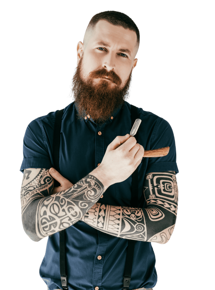 Barbero experto con barba y tatuajes, invitando a visitar la barbería en Miguel Hidalgo CDMX.